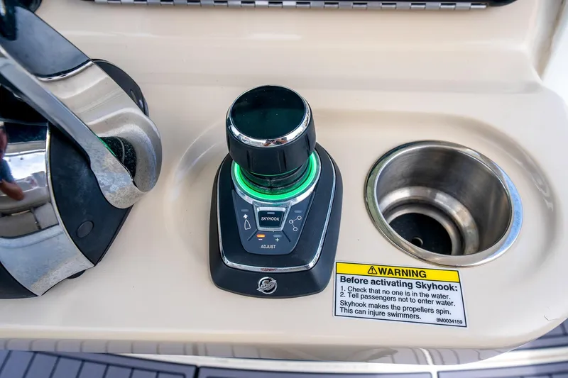 Slide: The Image of Control panel of 2018 Boston Whaler 280 Outrage with Skyhook joystick and warning label. - 21