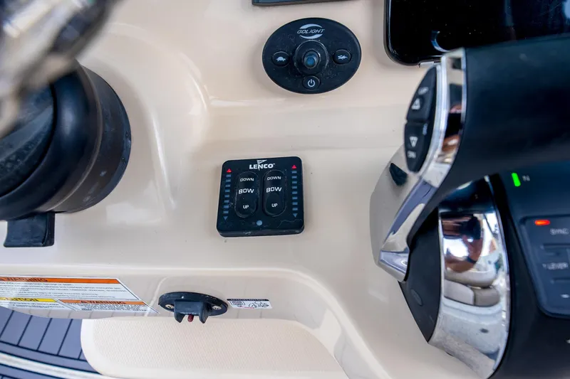 Slide: The Image of Control panel of a 2018 Boston Whaler 280 Outrage boat, featuring Lenco trim tabs. - 22