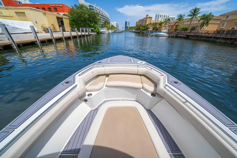 Slide: The Image of 2018 Boston Whaler 280 Outrage boat on a scenic urban waterway. - 29