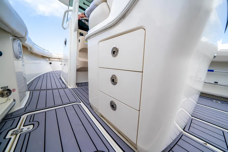 Slide: The Image of 2018 Boston Whaler 280 Outrage interior with sleek storage drawers and modern flooring. - 31