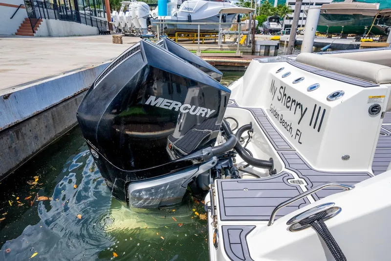 Slide: The Image of 2018 Boston Whaler 280 Outrage with Mercury engine docked at marina, "My Sherry III" visible. - 37