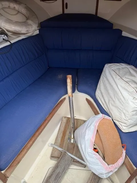 Slide: The Image of Interior of 1986 Blackfin 27 boat with blue seating and nautical equipment. - 6