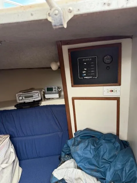 Slide: The Image of Interior of 1986 Blackfin 27 boat with control panel and blue seating. - 9