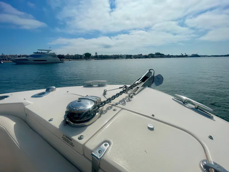 Slide: The Image of Bow view of 2015 Grady-White 275 Freedom boat on calm water. - 12