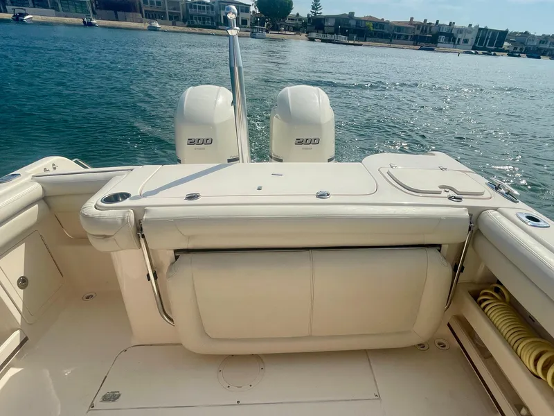 Slide: The Image of 2015 Grady-White 275 Freedom boat with dual 200 engines on a sunny day. - 14