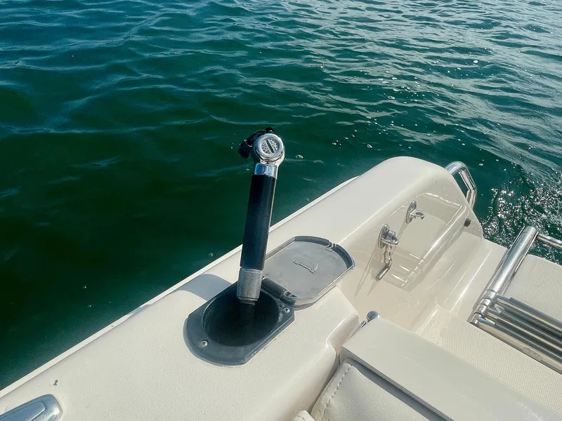 Slide: The Image of 2015 Grady-White 275 Freedom boat deck with rod holder, near water. - 16