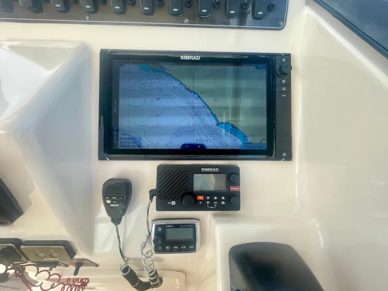 Slide: The Image of Control panel of 2015 Grady-White 275 Freedom boat with Simrad navigation system. - 20