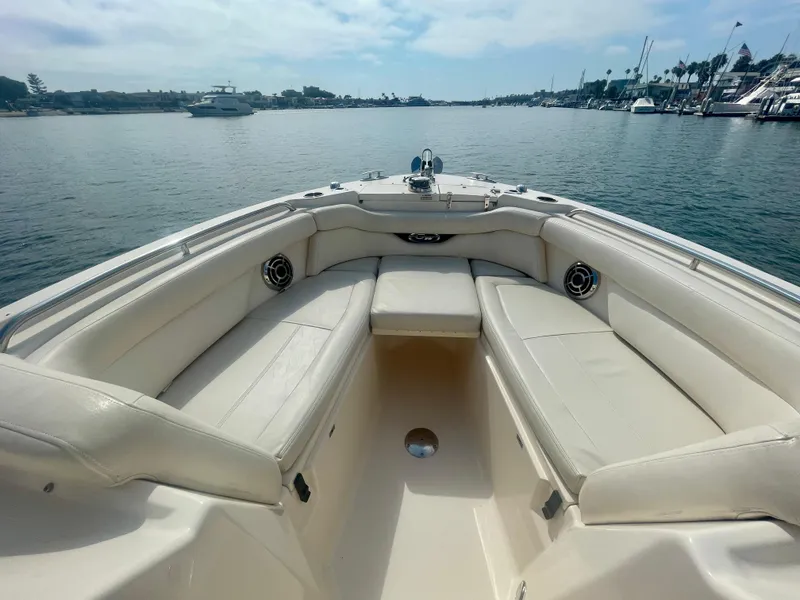 Slide: The Image of 2015 Grady-White 275 Freedom boat interior with spacious seating on calm water. - 4