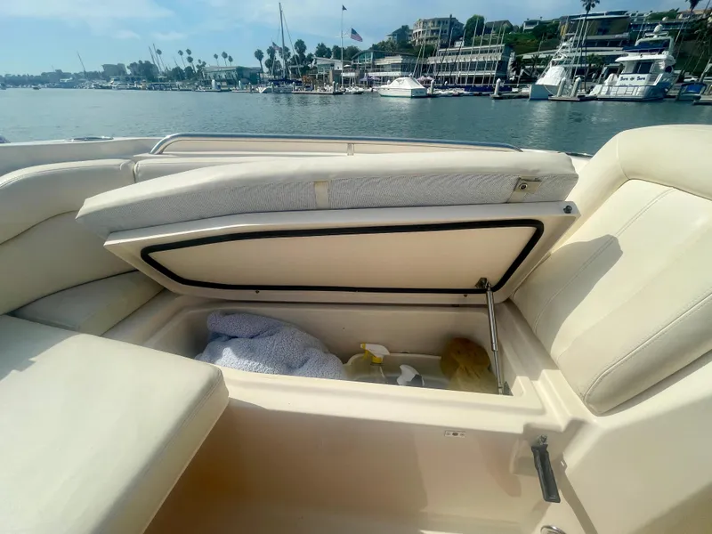 Slide: The Image of Open storage compartment on 2015 Grady-White 275 Freedom boat, docked at marina. - 5