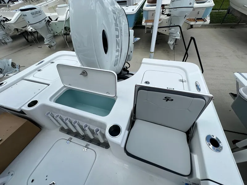 Slide: The Image of 2026 Sea Pro 230 Bay boat with Suzuki engine, featuring storage compartments and seating. - 15