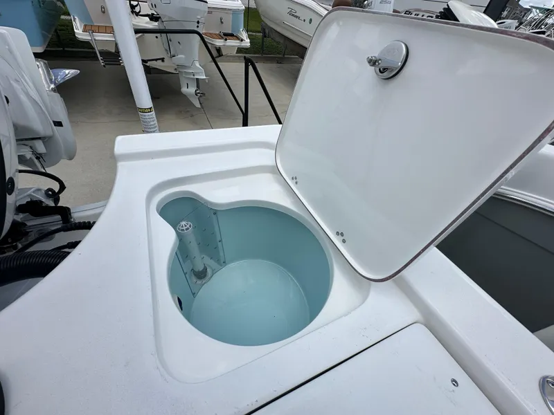 Slide: The Image of Open storage compartment on a 2026 Sea Pro 230 Bay boat. - 16