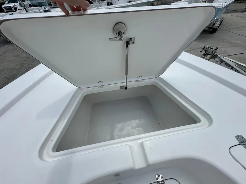 Slide: The Image of Open storage compartment on 2026 Sea Pro 230 Bay boat, showcasing spacious interior. - 8