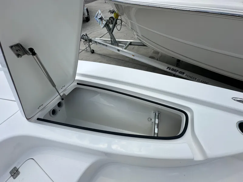 Slide: The Image of Open storage compartment on 2026 Sea Pro 230 Bay boat, showcasing interior space. - 9