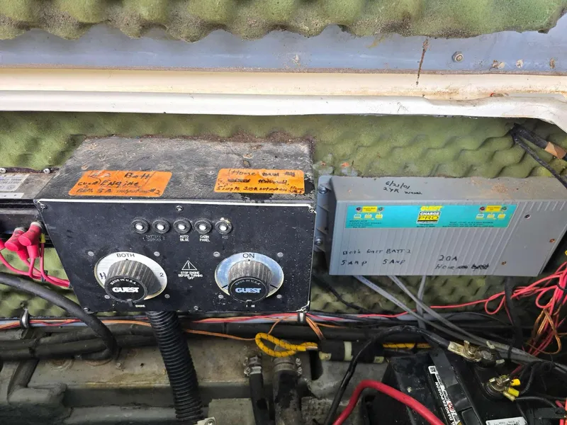 Slide: The Image of Control panel and battery charger in a 1996 Rinker 280 Fiesta Vee boat. - 13