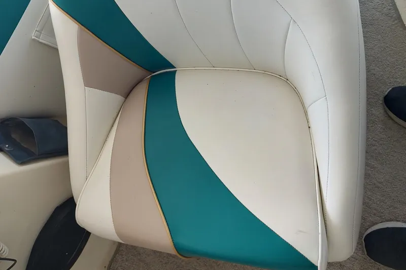 Slide: The Image of White and teal boat seat on 1996 Rinker 280 Fiesta Vee. - 21