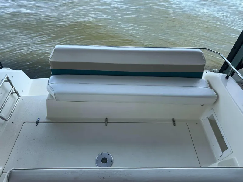 Slide: The Image of 1996 Rinker 280 Fiesta Vee boat seating area with water view. - 9