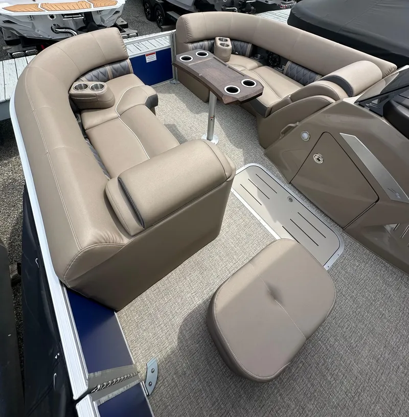 Slide: The Image of 2025 Bennington 23 LXSFB boat interior with plush seating and cup holders. - 10