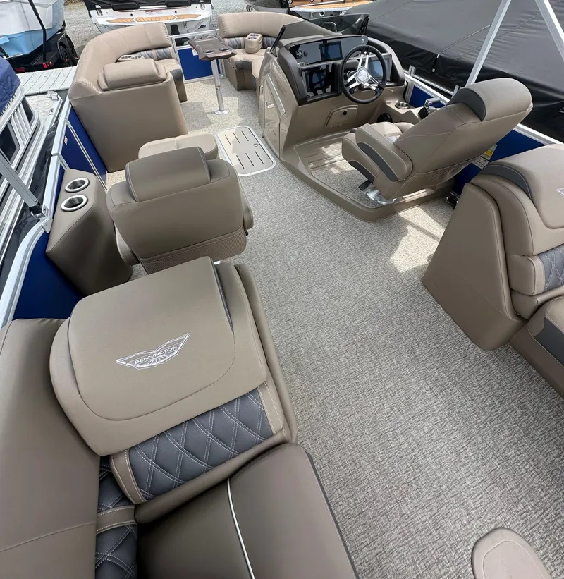 Slide: The Image of 2025 Bennington 23 LXSFB pontoon boat interior with luxurious seating and modern helm. - 7