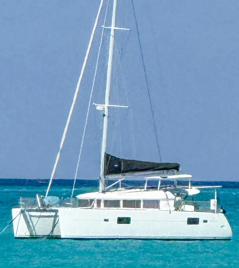 Slide: The Image of 2011 Lagoon 400 catamaran sailing on clear blue waters. - 2