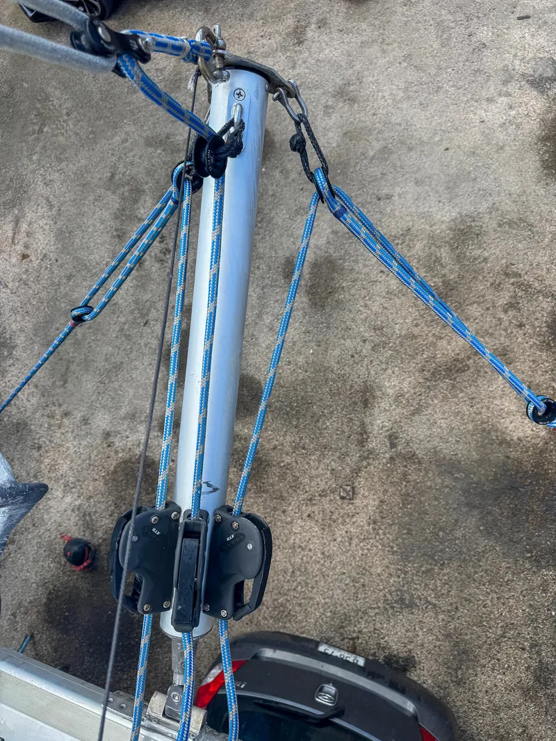 Slide: The Image of Rigging system of a 2011 Lagoon 400 catamaran with blue ropes and pulleys. - 20