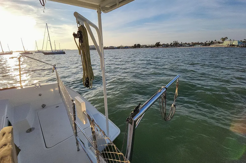 Slide: The Image of Lagoon 400 catamaran deck view, 2011 model, overlooking calm waters and distant shoreline. - 29