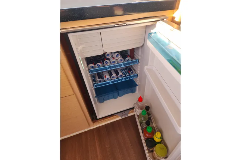 Slide: The Image of Compact fridge on Lagoon 400 yacht, stocked with beverages and condiments, 2011 model. - 37