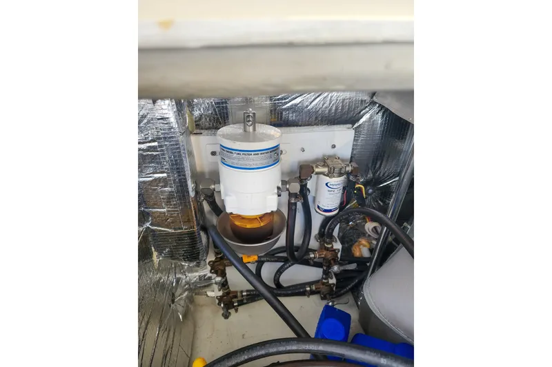 Slide: The Image of Engine compartment of 2011 Lagoon 400 with fuel filter and water separator system. - 52