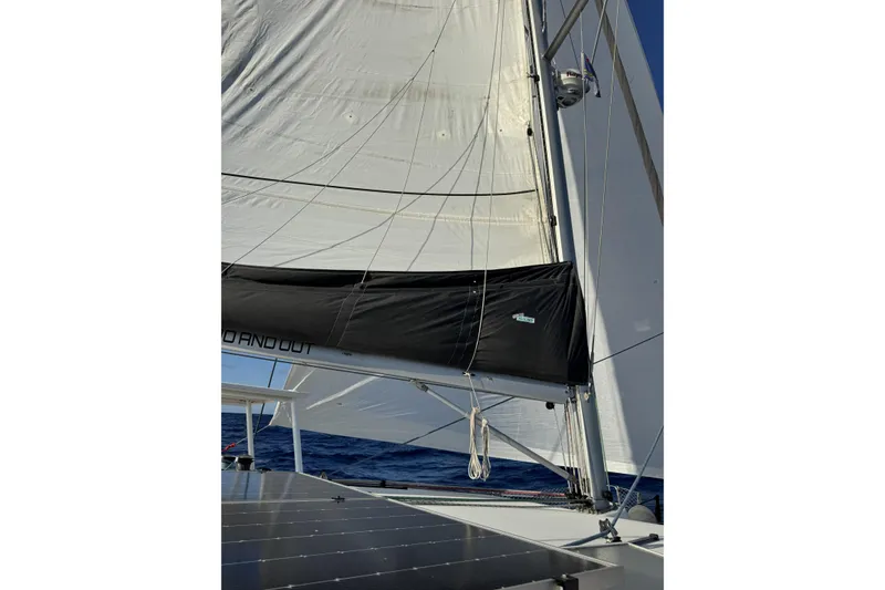 Slide: The Image of Sailing yacht Lagoon 400, 2011 model, with sails unfurled on open sea. - 58