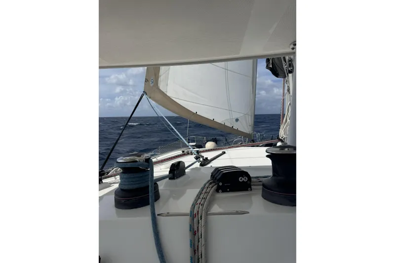 Slide: The Image of Sailing on a 2011 Lagoon 400 catamaran, open sea view with sails unfurled. - 59