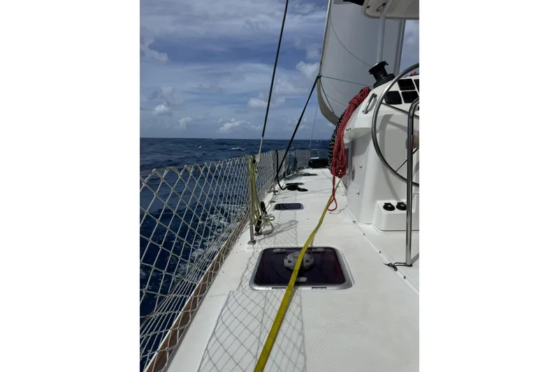 Slide: The Image of Sailing on a 2011 Lagoon 400 catamaran, open sea view, clear skies. - 60