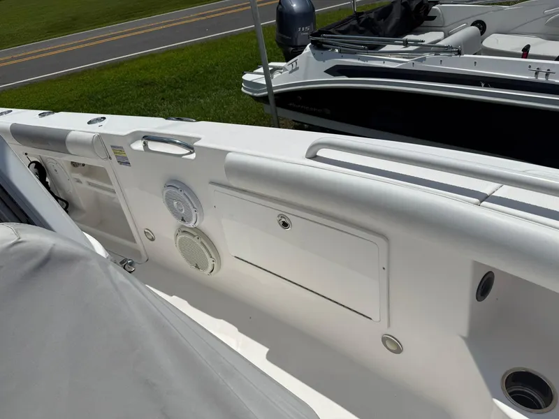 Slide: The Image of 2018 Everglades 255 Center Console boat interior with speakers and storage compartment. - 10