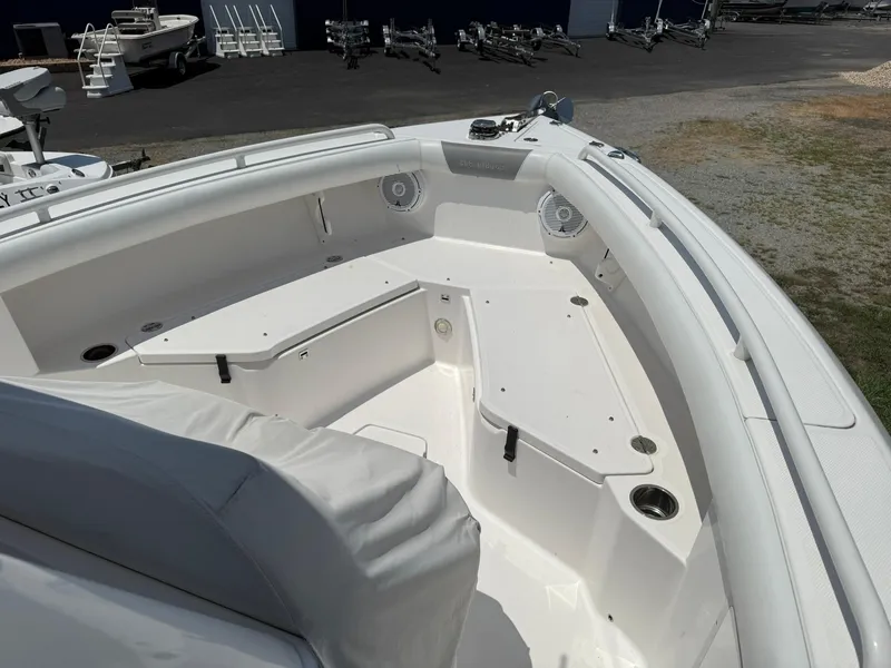Slide: The Image of 2018 Everglades 255 Center Console boat interior with seating and storage compartments. - 13
