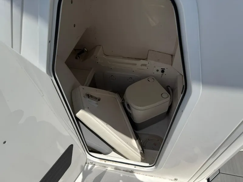 Slide: The Image of Interior of 2018 Everglades 255 Center Console boat with compact marine toilet. - 14