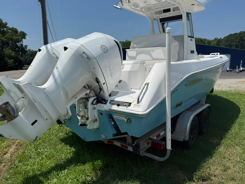 Slide: The Image of 2018 Everglades 255 Center Console boat with dual Yamaha outboard engines on a trailer. - 2