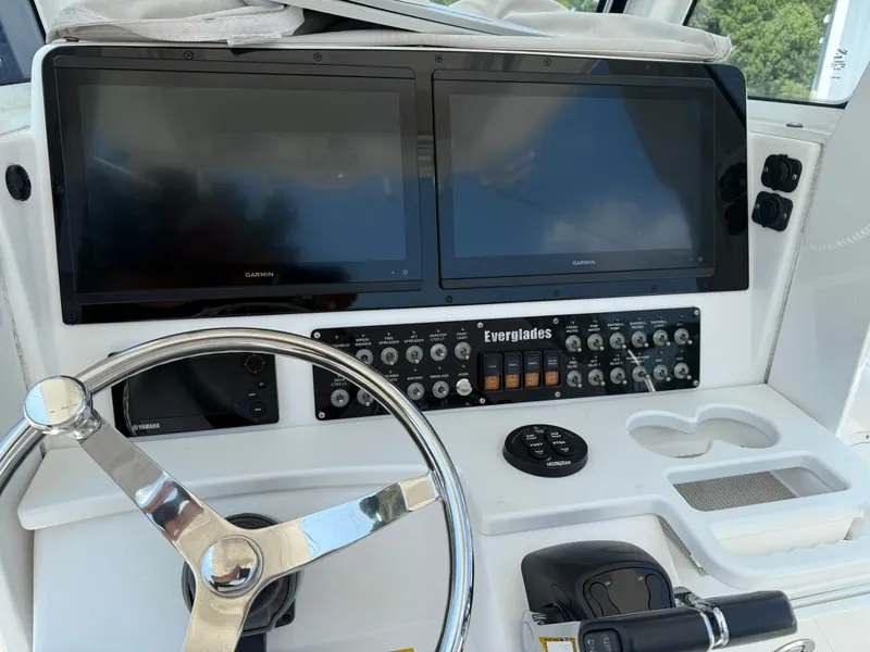 Slide: The Image of Control panel of a 2018 Everglades 255 Center Console boat with dual Garmin screens. - 3