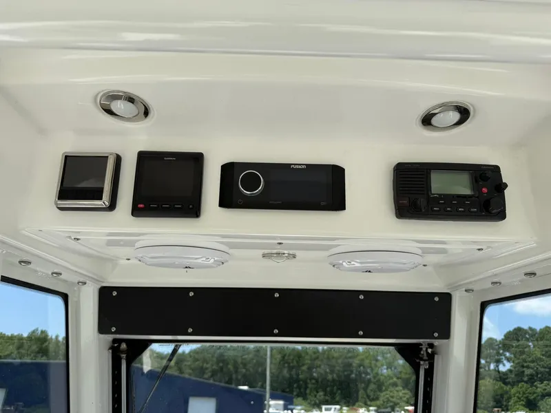 Slide: The Image of Control panel of 2018 Everglades 255 Center Console boat with electronic devices. - 4