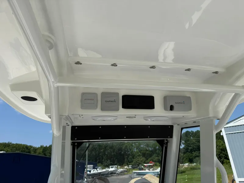 Slide: The Image of 2018 Everglades 255 Center Console boat interior with Garmin electronics and overhead console. - 7