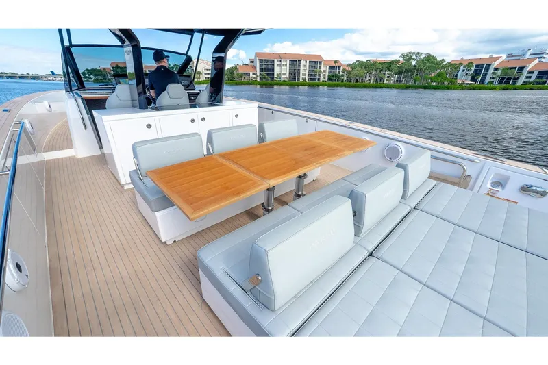 Slide: The Image of Luxurious 2024 Pardo Yachts 43 with elegant seating and dining area on deck. - 14