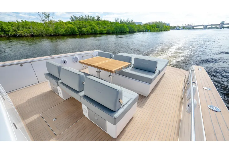 Slide: The Image of Luxurious 2024 Pardo Yachts 43 with elegant seating and wooden table on deck. - 16