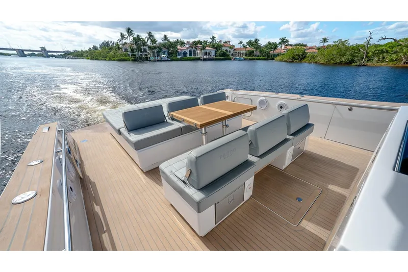 Slide: The Image of Luxurious 2024 Pardo Yachts 43 with elegant seating and scenic waterway view. - 17