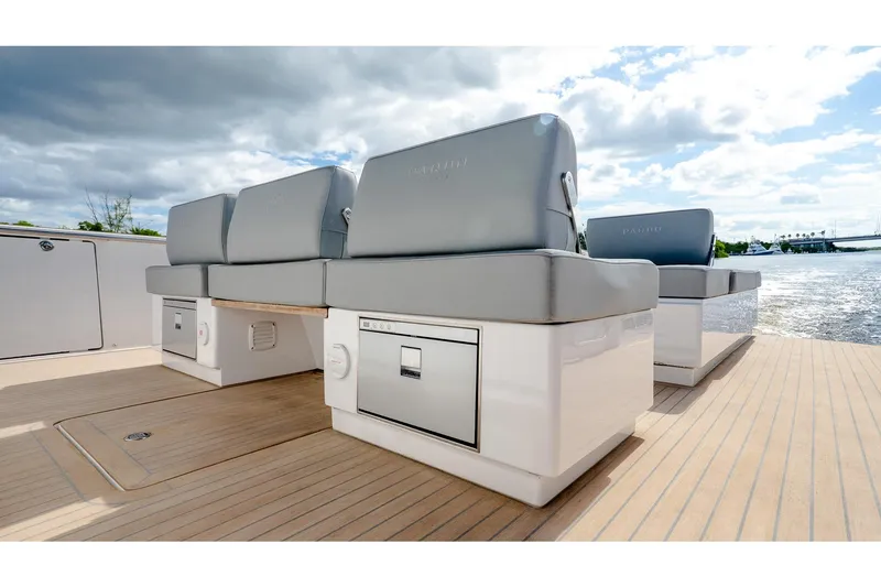 Slide: The Image of 2024 Pardo Yachts 43 interior with sleek seating and storage, overlooking serene waters. - 18