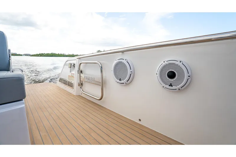 Slide: The Image of 2024 Pardo Yachts 43 deck with speakers, cruising on water. - 19