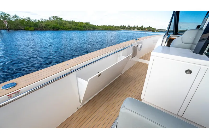 Slide: The Image of 2024 Pardo Yachts 43 deck with sleek design and open storage compartment. - 20