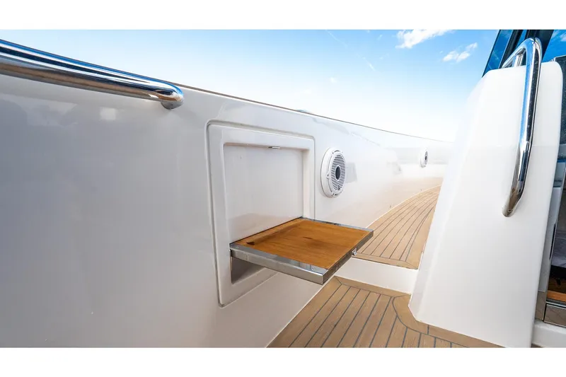 Slide: The Image of 2024 Pardo Yachts 43 interior detail with wooden fold-out table and sleek design. - 21