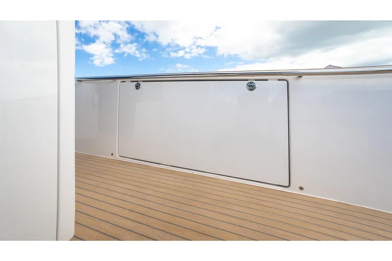 Slide: The Image of 2024 Pardo Yachts 43 deck with sleek white finish and wooden flooring. - 22