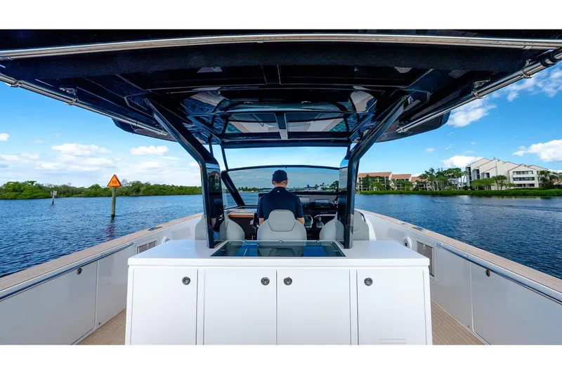 Slide: The Image of 2024 Pardo Yachts 43 cruising on a scenic waterway with modern design. - 28