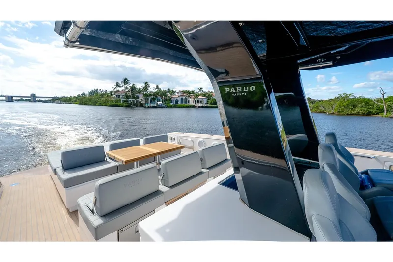 Slide: The Image of 2024 Pardo Yachts 43 cruising on a scenic river with luxurious seating and sleek design. - 29