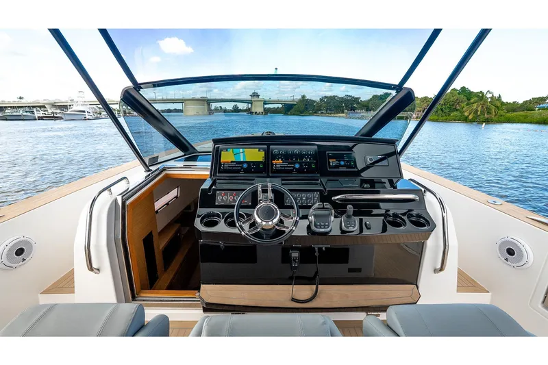 Slide: The Image of 2024 Pardo Yachts 43 helm with advanced navigation systems and luxurious design on open water. - 34