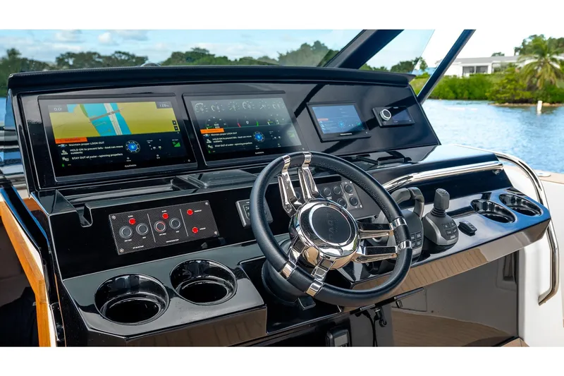 Slide: The Image of 2024 Pardo Yachts 43 helm with advanced navigation displays and controls. - 35