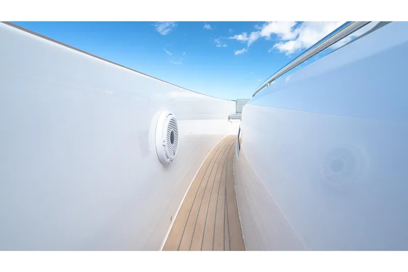 Slide: The Image of Side deck view of 2024 Pardo Yachts 43, featuring sleek design and clear blue sky. - 38